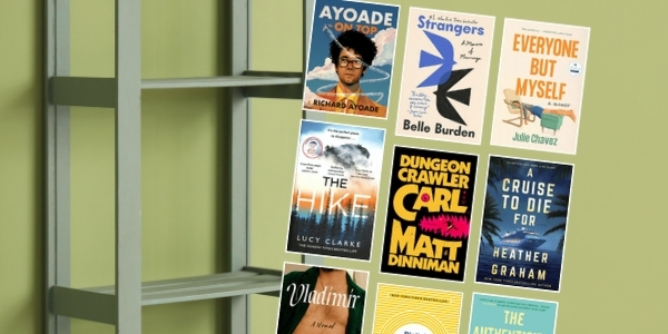 green bookself and wall with various book covers