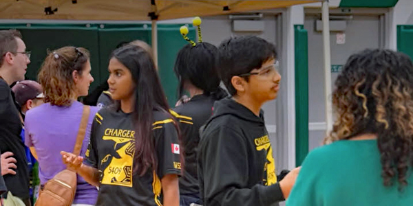 a crowd of students talking