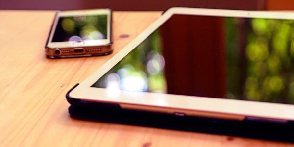 two iPads placed on a table