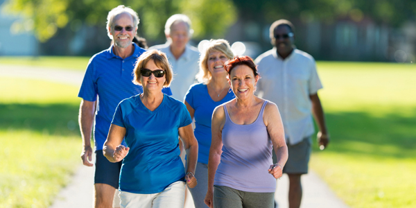 group of adults walking along a path