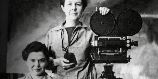 vintage photo of two women and an old film camera