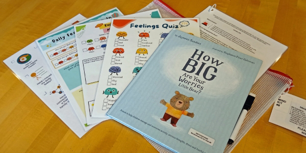 picture book with various laminated activity cards