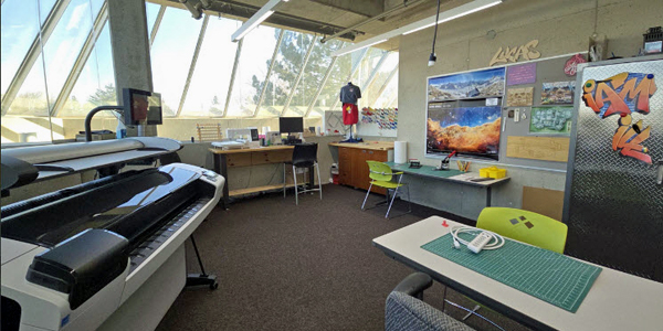 wide view of the MakerSpace at Central Branch including the large format printer and embroidery machine