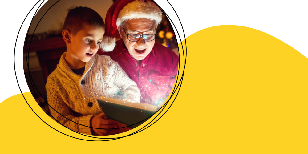 older adult wearing a Santa hat sharing a book with young child