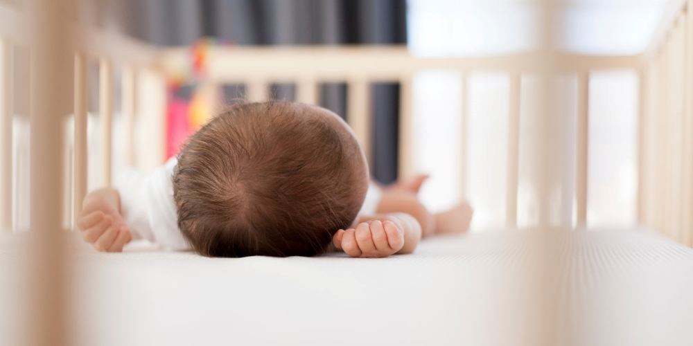 baby sleeping in a crib