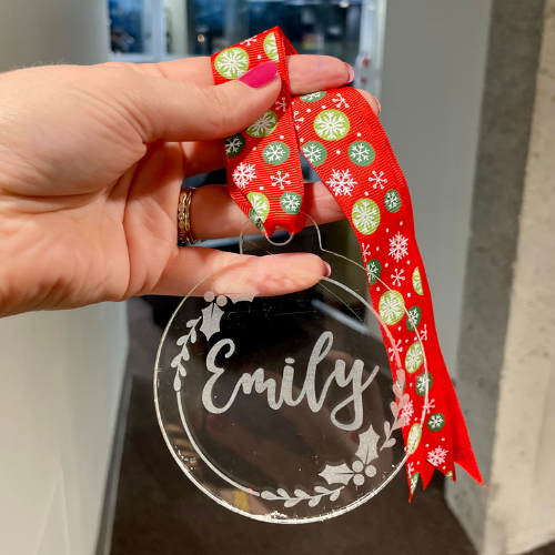 clear acrylic ornament engraved with "Emily"