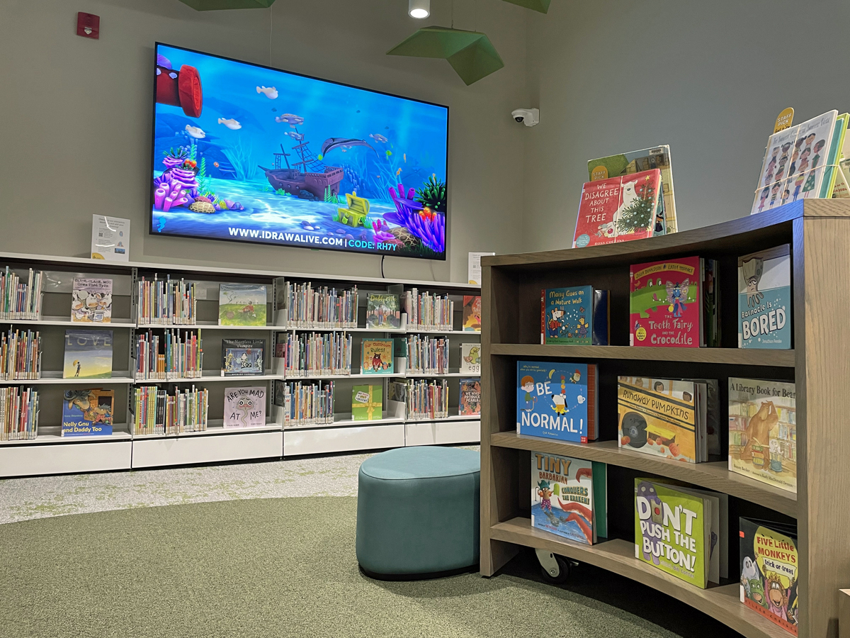 interactive digital screen and booksheves