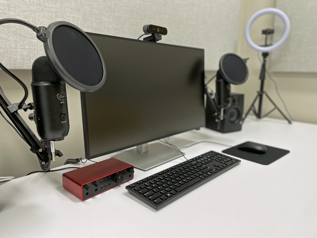 computer, ring lamps, keyboard, and microphones