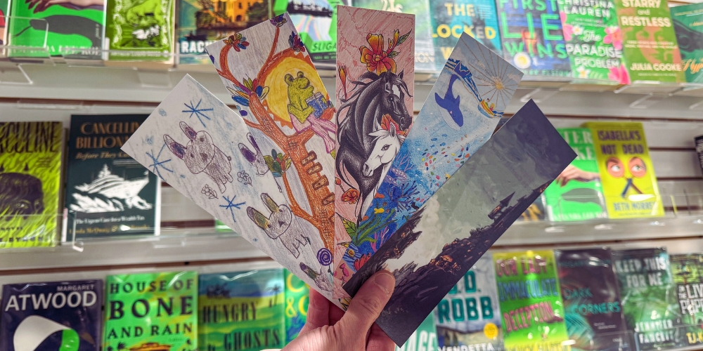 hand holding the five winning bookmarks