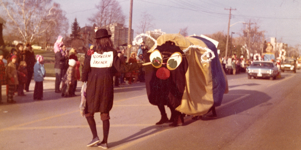 BPL Santa Claus Parade entry, an oversized bookworm with its human trainer, circa late 1960s-70s.