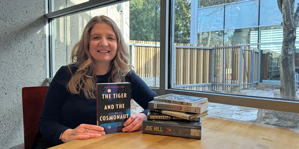 BPL CEO Lita Barrie with a selection of her Reading Challenge books