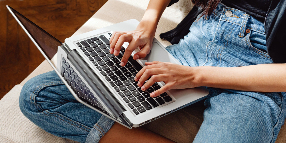 person seated with a laptop