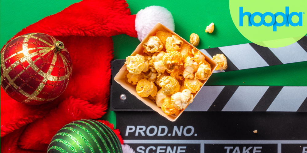 popcorn, two decorative bulbs, and scene board beside Hoopla logo