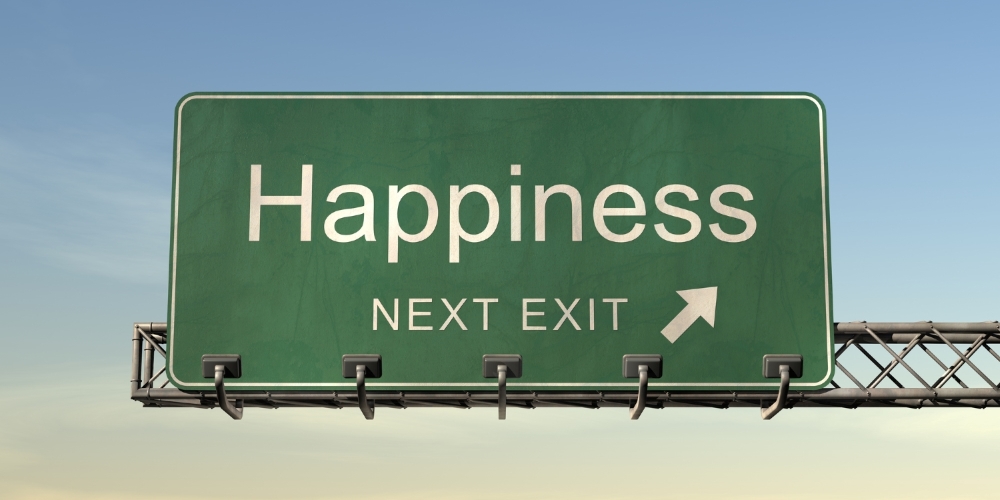 highway sign stating Happiness Next Exit