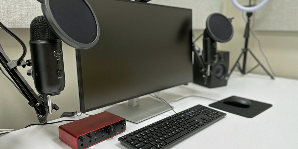computer screen, keyboard, microphones